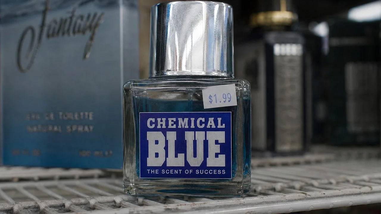 A cheap cologne bottle labelled Chemical Blue on a shop shelf